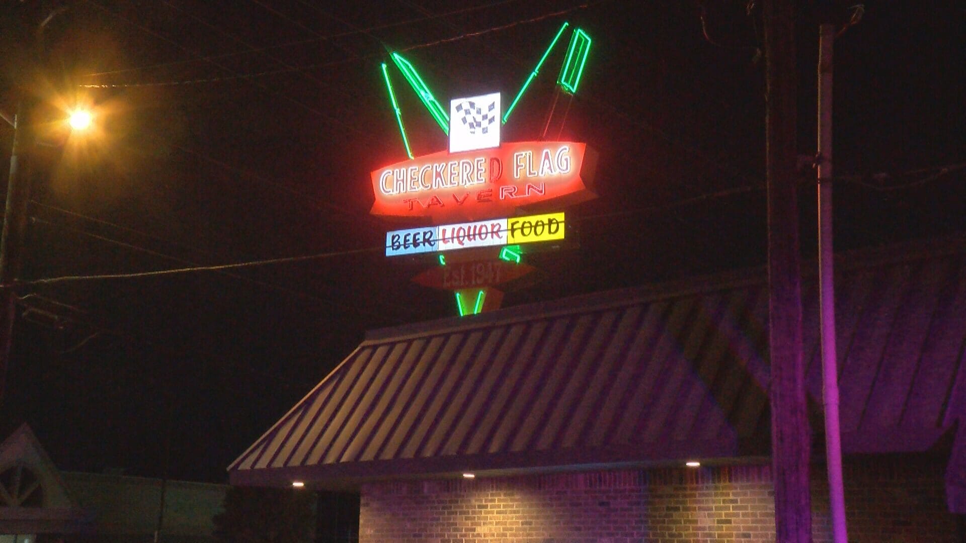 The sign of Checkered Flag Tavern at 5725 W. Morris St. A man was killed in a hit-and-run in Checkered Flag's parking lot on Oct. 19, 2024. (WISH Photo)