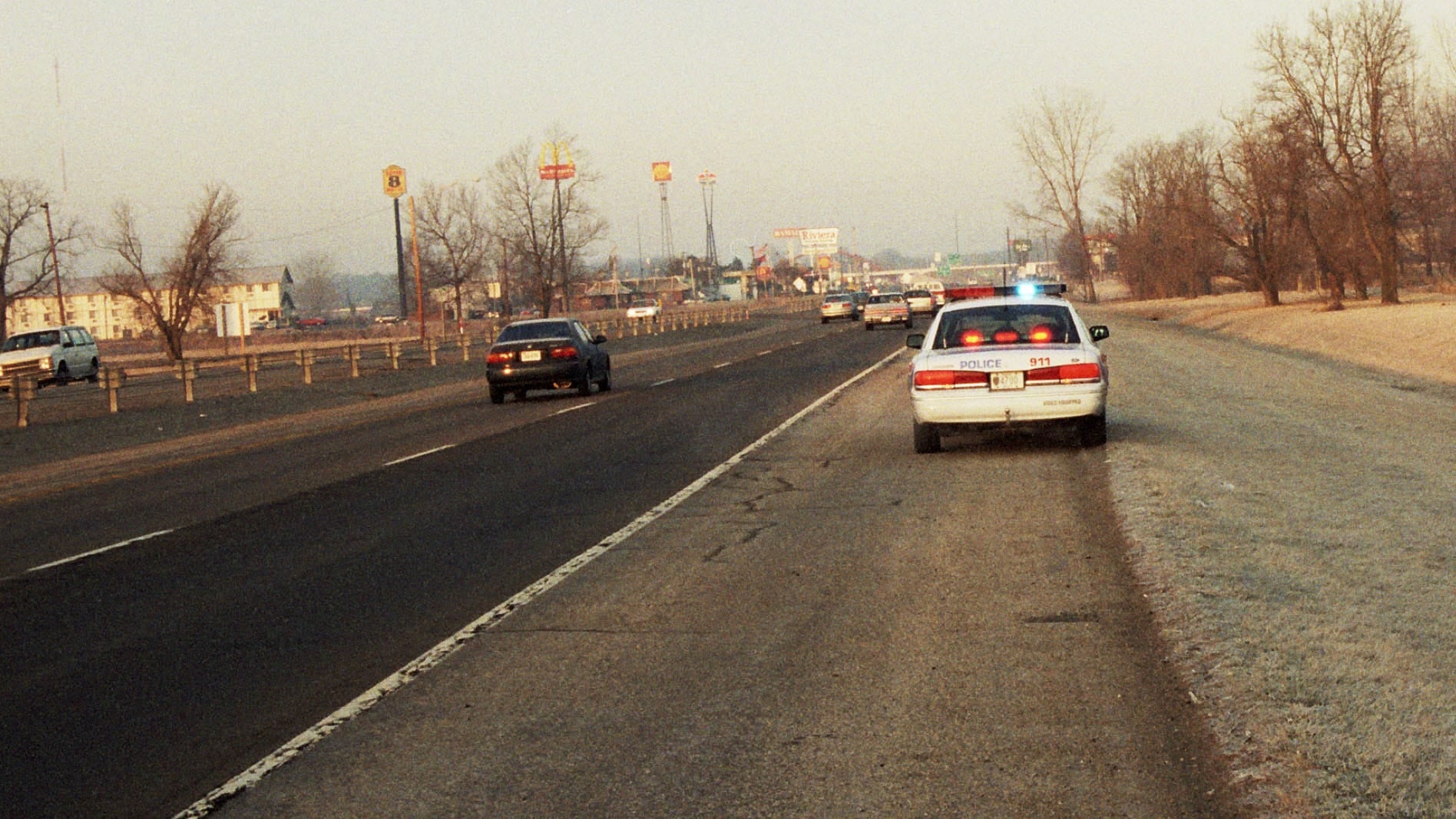 In this picture taken on Jan. 30, 1999, Columbus Police Department officers are on the scene where an unidentified man was found dead. After 25 years, investigators finally identified him as a 61-year-old man from Ohio. (Provided Photo/Columbus Police Department via Facebook)