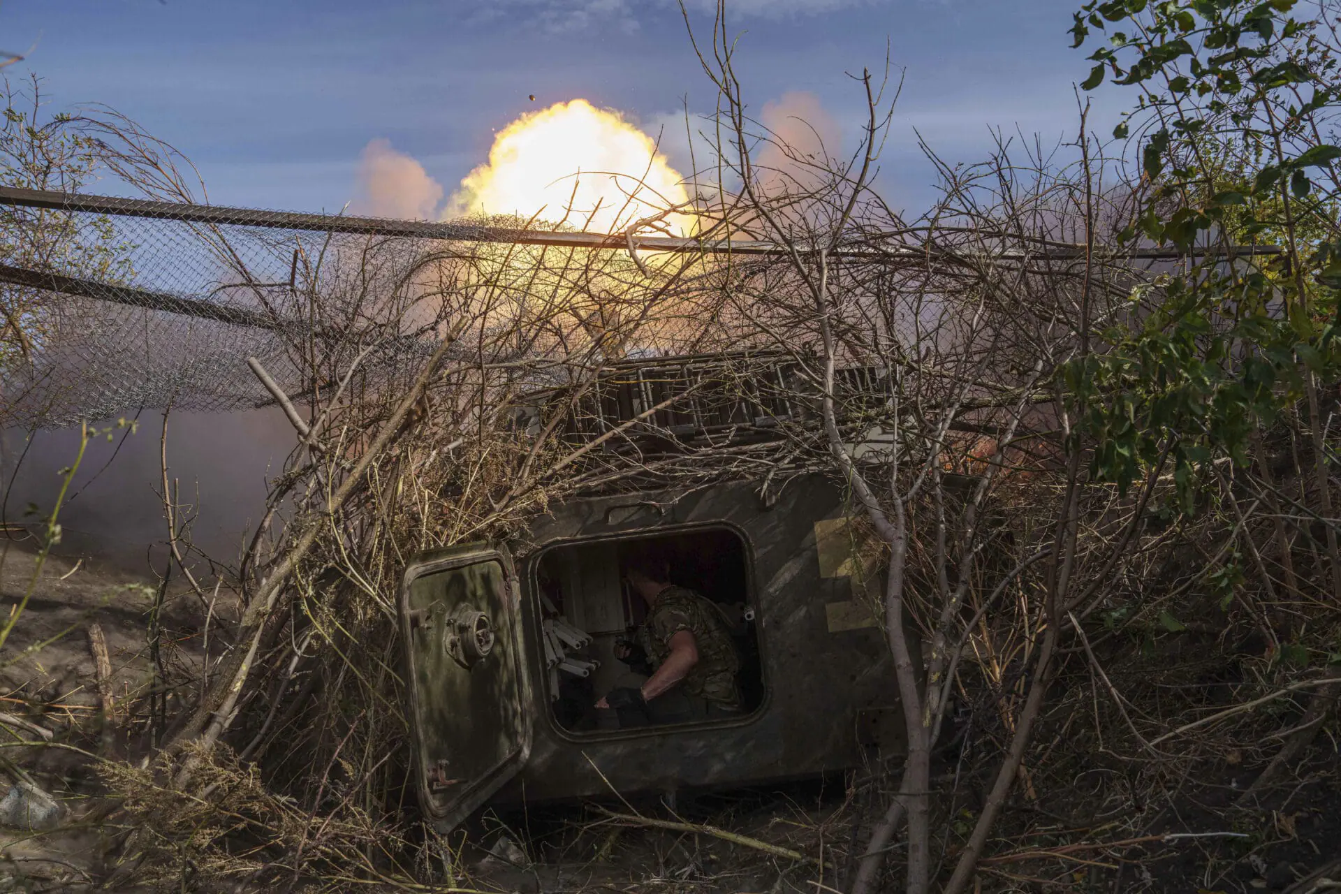 FILE – A Ukrainian serviceman of 56th brigade fires artillery toward Russian positions at the front line near Chasiv Yar in the Donetsk region of Ukraine, on Sept. 27, 2024. (AP Photo/Evgeniy Maloletka, File)