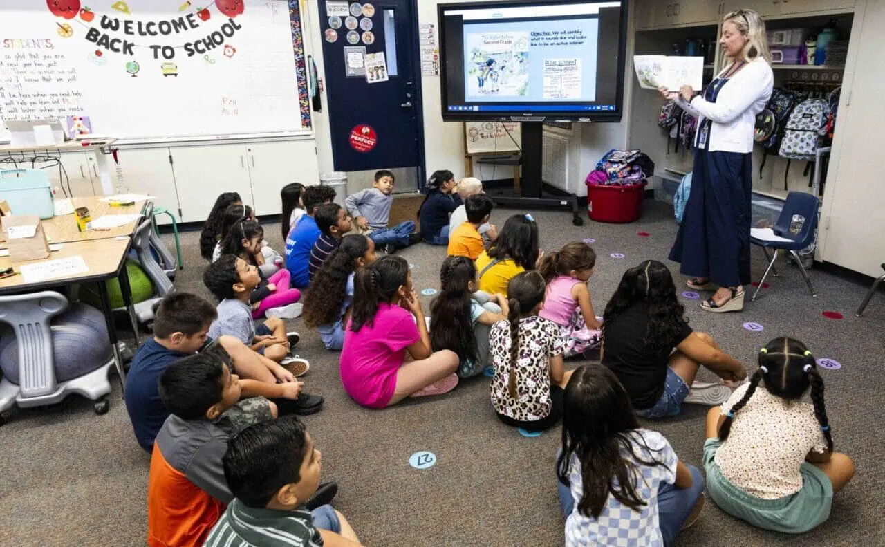 Teacher Silvia Aubol reads to her second grade students on the first day of class on Thursday, August 8, 2024. (Photo by Paul Bersebach/MediaNews Group/Orange County Register via Getty Images)