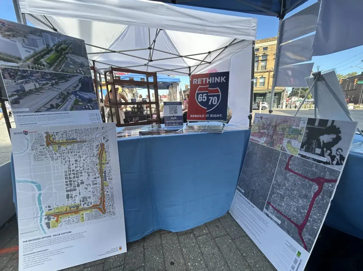 A Rethink Coalition booth at Art Squared in Indianapolis featuring Informational posters and design renderings for development changes to I-65 and I-70. (Provided Photo/Rethink Coalition)