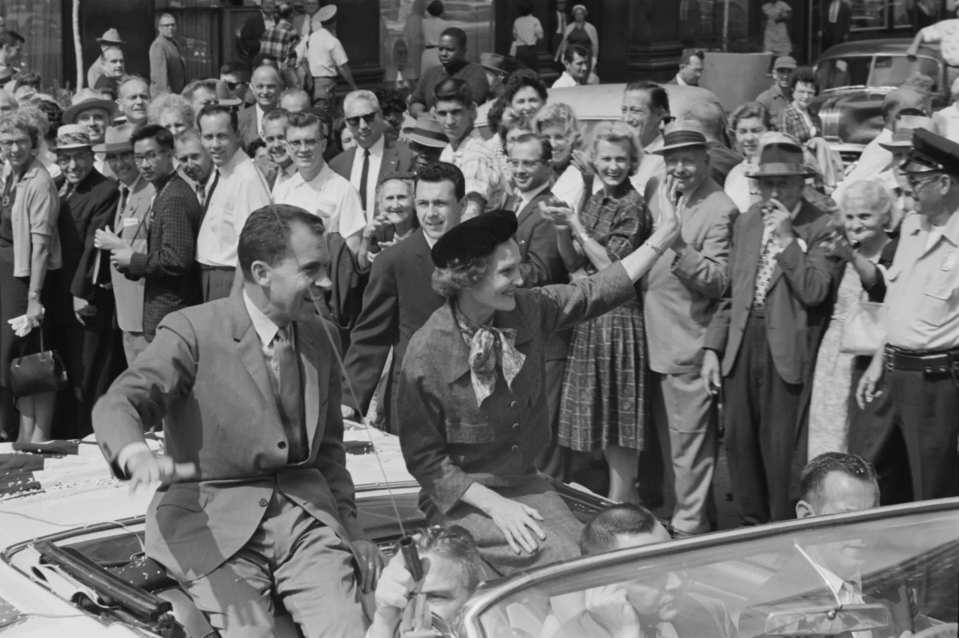 American Vice President and presidential candidate Richard Nixon and his wife Pat Nixon wave to the crowds while sitting on the back of an open top convertible while campaigning in Indianapolis, Indiana, on Sept. 14, 1960. (Photo by O'Halloran/Library of Congress/Interim Archives/Getty Images)