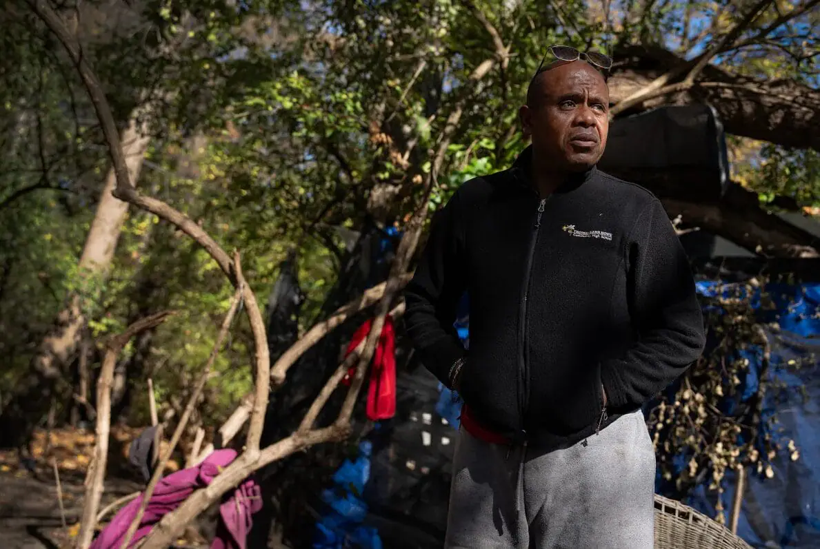 Humberto Acebedo stands near the encampment where he’s been staying for several months, Nov. 1, 2024, at a park on the corner of East Washington Street and Emerson Avenue in Indianapolis. (Provided Photo/Jenna Watson/Mirror Indy)