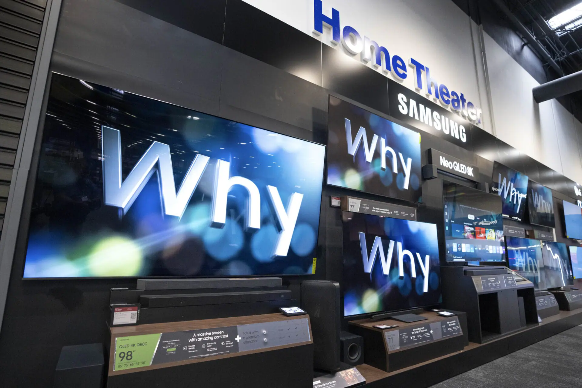 An 98-inch Samsung television, left, sits by others of various sizes on display at a Best Buy store in Dallas, Friday, Oct. 25, 2024. (AP Photo/Tony Gutierrez)