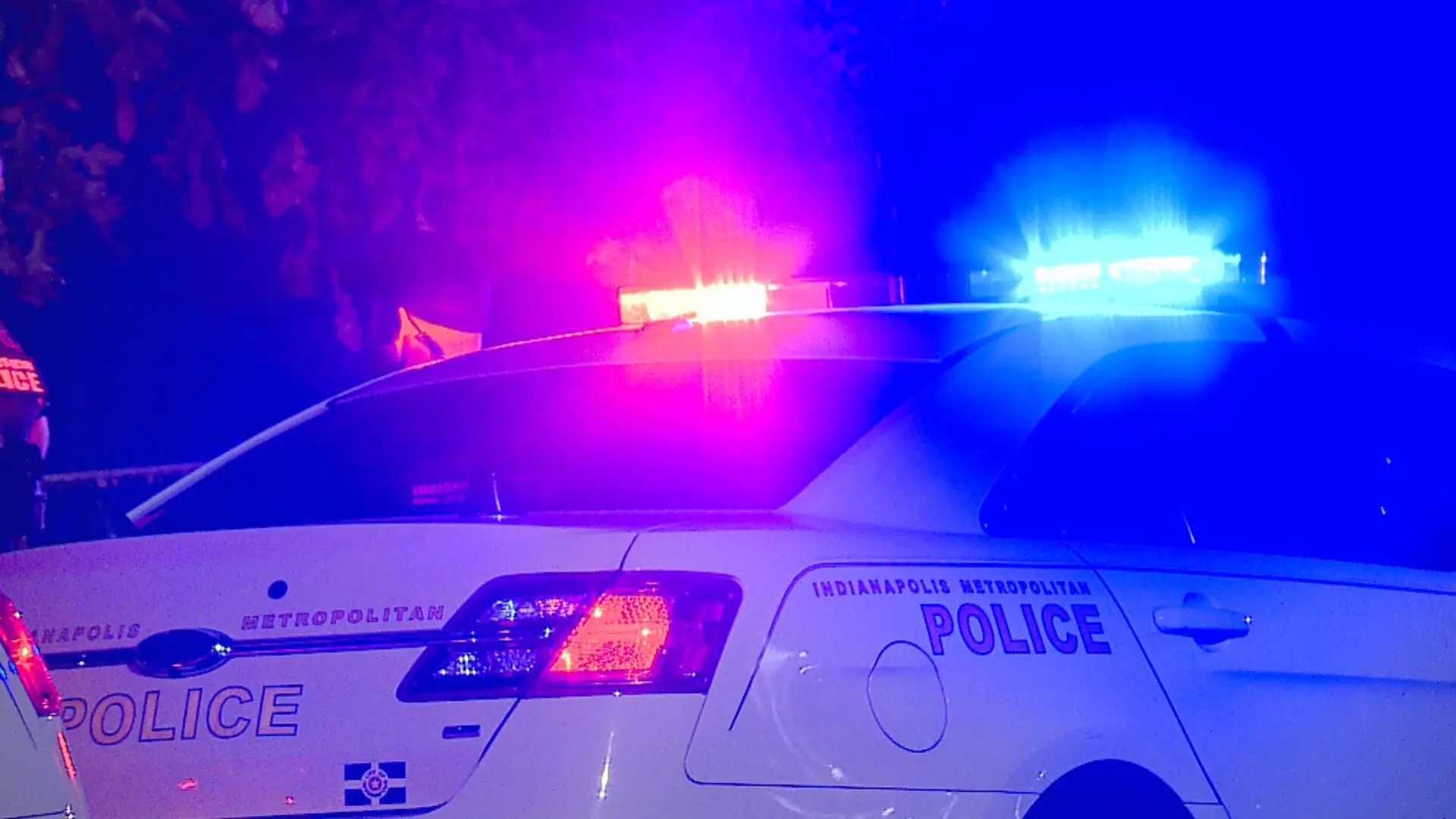 Illuminated red and blue police lights on the roof of an IMPD patrol car. (WISH Photo)