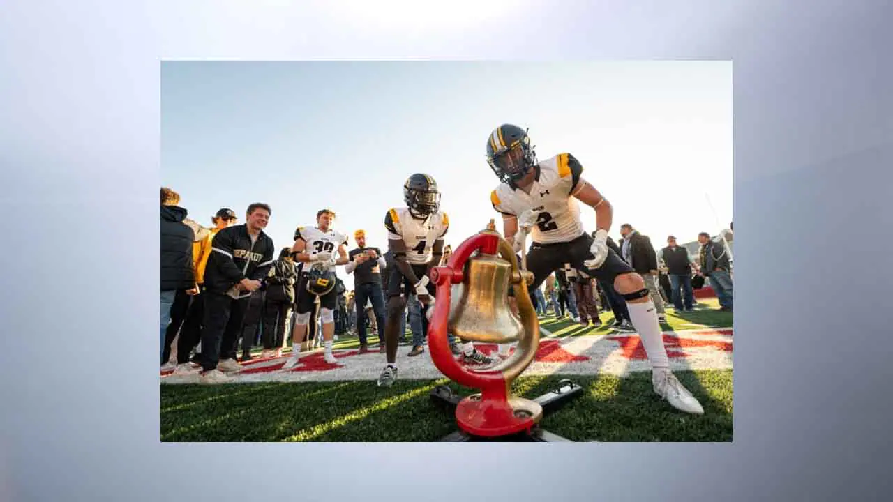 DePauw University players ring the Monon Bell after beating Wabash College in 2023 (Provided Photo/DePauw University)