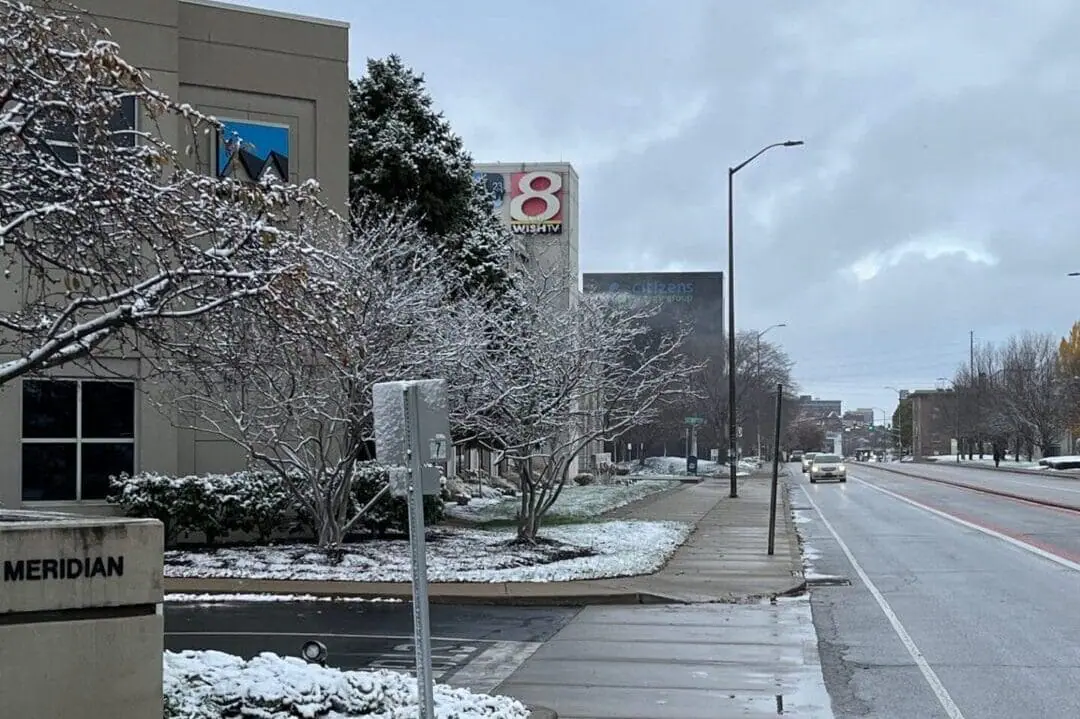 Snow sits on the grass outside the WISH-TV studio at 1950 N. Meridian Street after the first snow of the season on the morning on Nov. 21, 2024. (WISH Photo/Dylan Hodges)