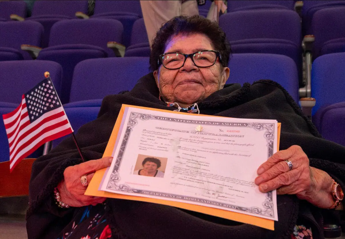 Catalina Dela Rosa holds her certificate of naturalization after becoming a U.S. citizen on Nov. 20, 2024, at the Central Library.