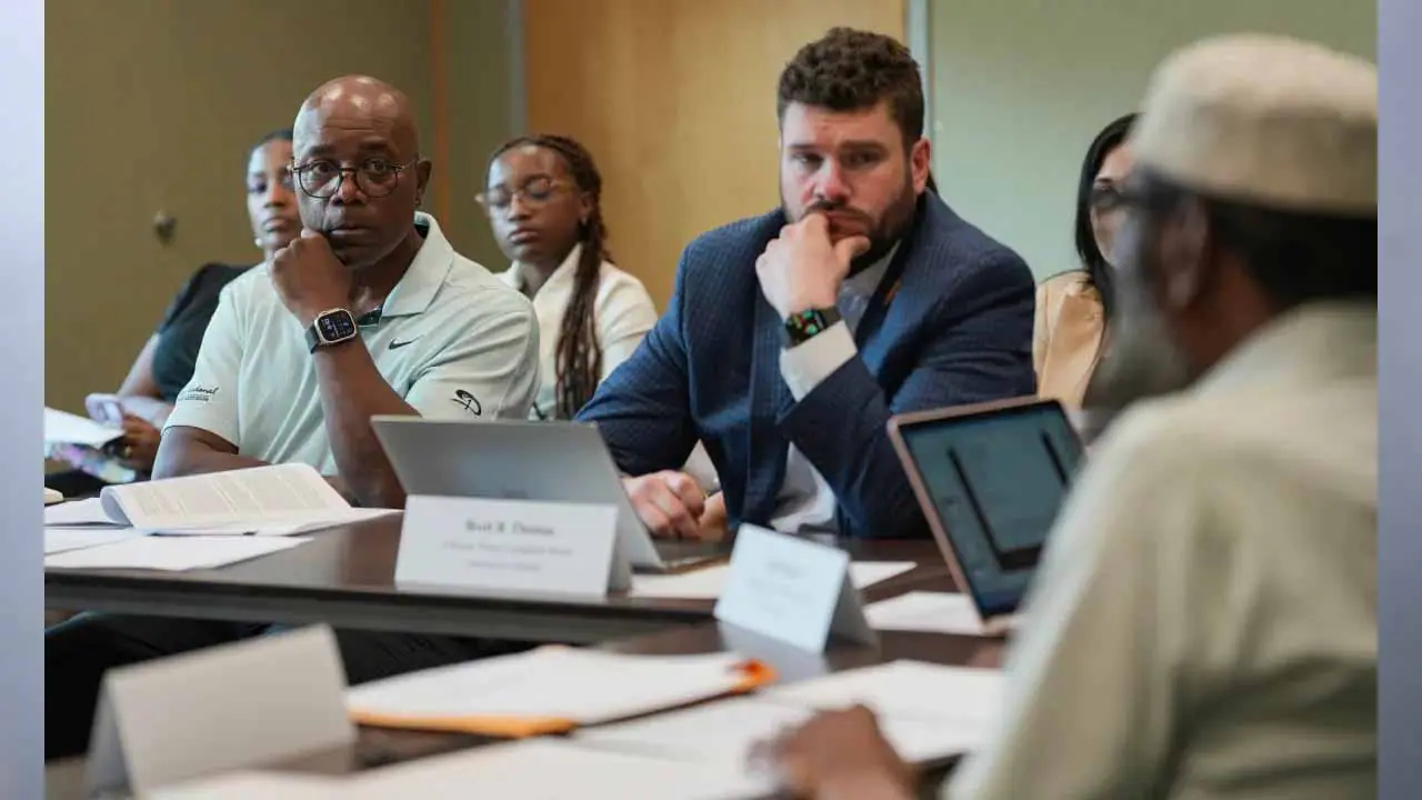 Kenneth Riggins (from left), and Brett B. Thomas, members of the Citizens’ Police Complaint Board, during a public meeting May 13, 2024, at the Indianapolis Public Library’s Haughville branch. (Photo by Jenna Watson/Mirror Indy)