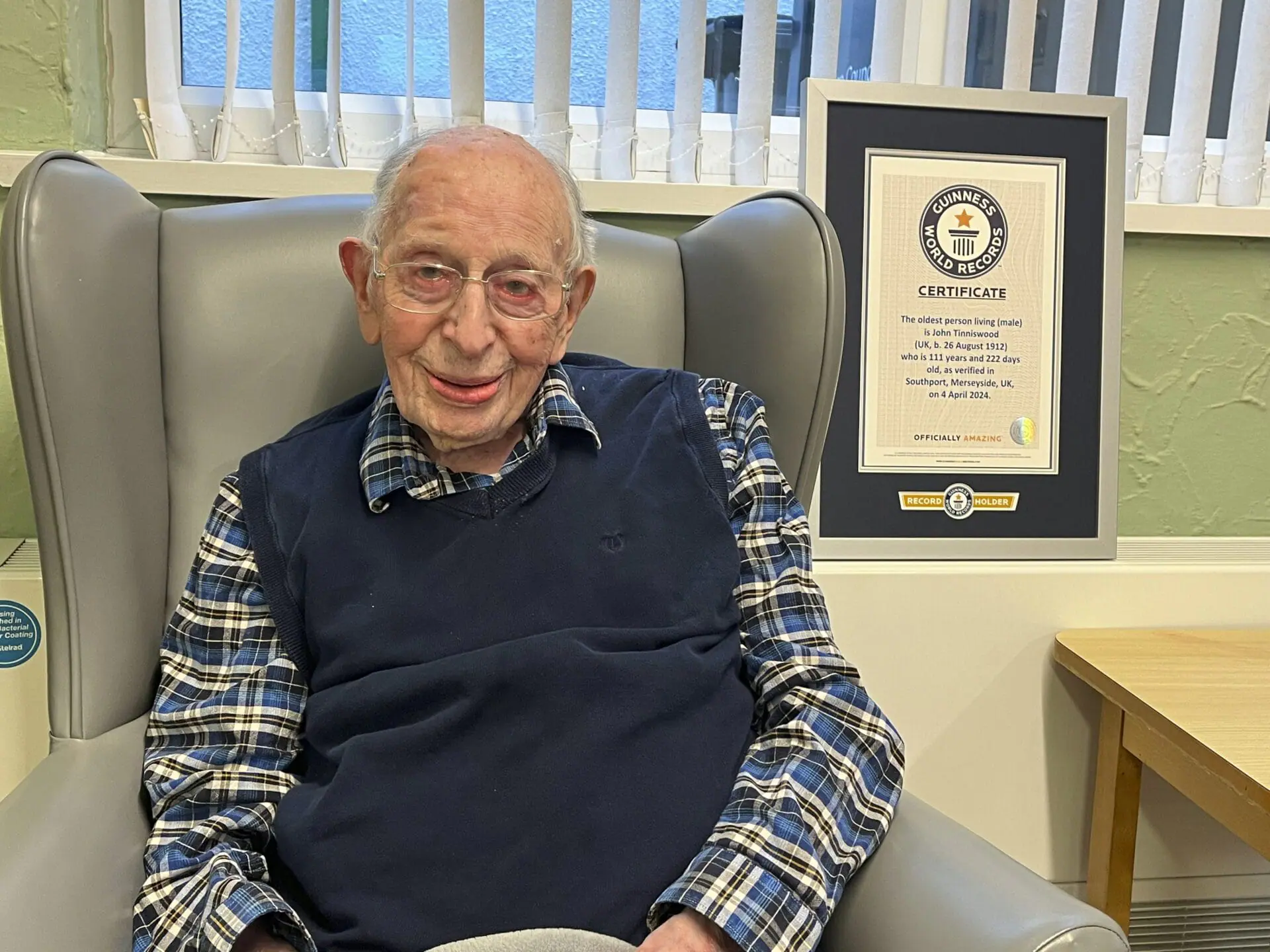 ohn Alfred Tinniswood poses for a photo on April 4, 2024. The world’s oldest man has died in England at age 112. The family of John Alfred Tinniswood said he died Monday, Nov. 25, 2024 at a care home outside Liverpool, where he was born in 1912. (Guinness World Records via AP)