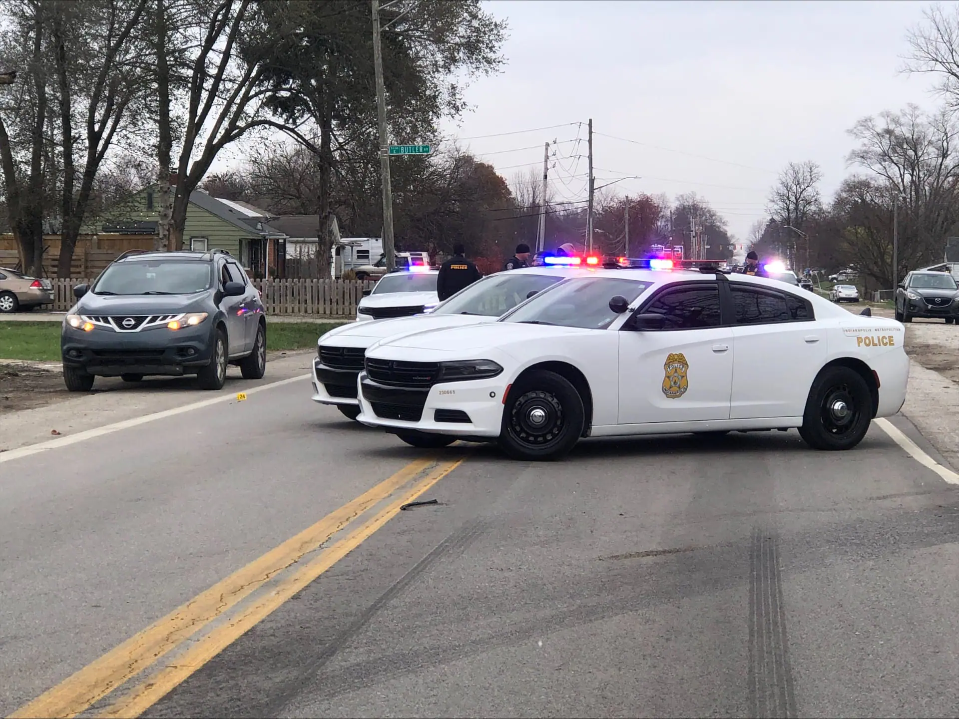 IMPD officers at the scene of a shooting on East 21st Street near Emerson Avenue that left a juvenile critically injured. (WISH Photo)