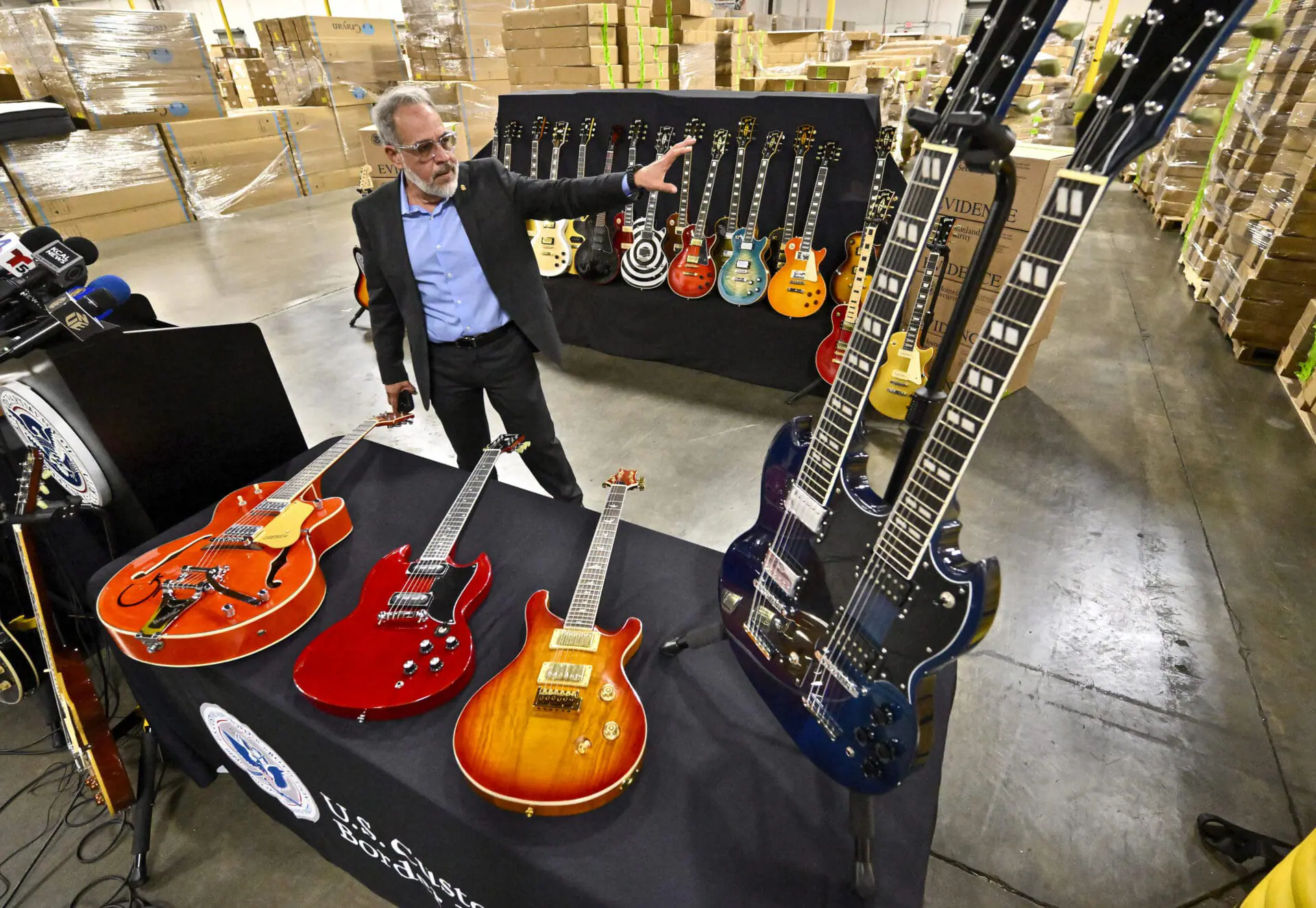 Jaime Ruiz, spokesman for the U.S. Customs and Border Protection, shows off fake guitars during a U.S. Customs and Border Protection media conference in Carson, Calif., on Tuesday, Nov. 26, 2024. (Jeff Gritchen/The Orange County Register via AP)