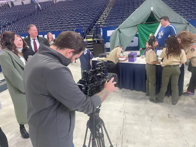 A photographer lines up a shot at the 29th annual Governor's Luncheon for Scouting. The 29th Governor’s Luncheon for Scouting is a celebration of scouting with over 2,000 local community leaders! Hosted by Governor Eric Holcomb and emceed by WISH-TV Sports Director Anthony Calhoun, the event at Lucas Oil Stadium raises funds for programs, camps, and trainings for over 16,000 youth in central Indiana. DuJuan McCoy, President, Owner and CEO of Circle City Broadcasting (parent company of WISH-TV) is a co-chair for this year’s event. Visit crossroadsbsa.org to learn more about Scouting in central Indiana. (WISH Photo/Al Carl)