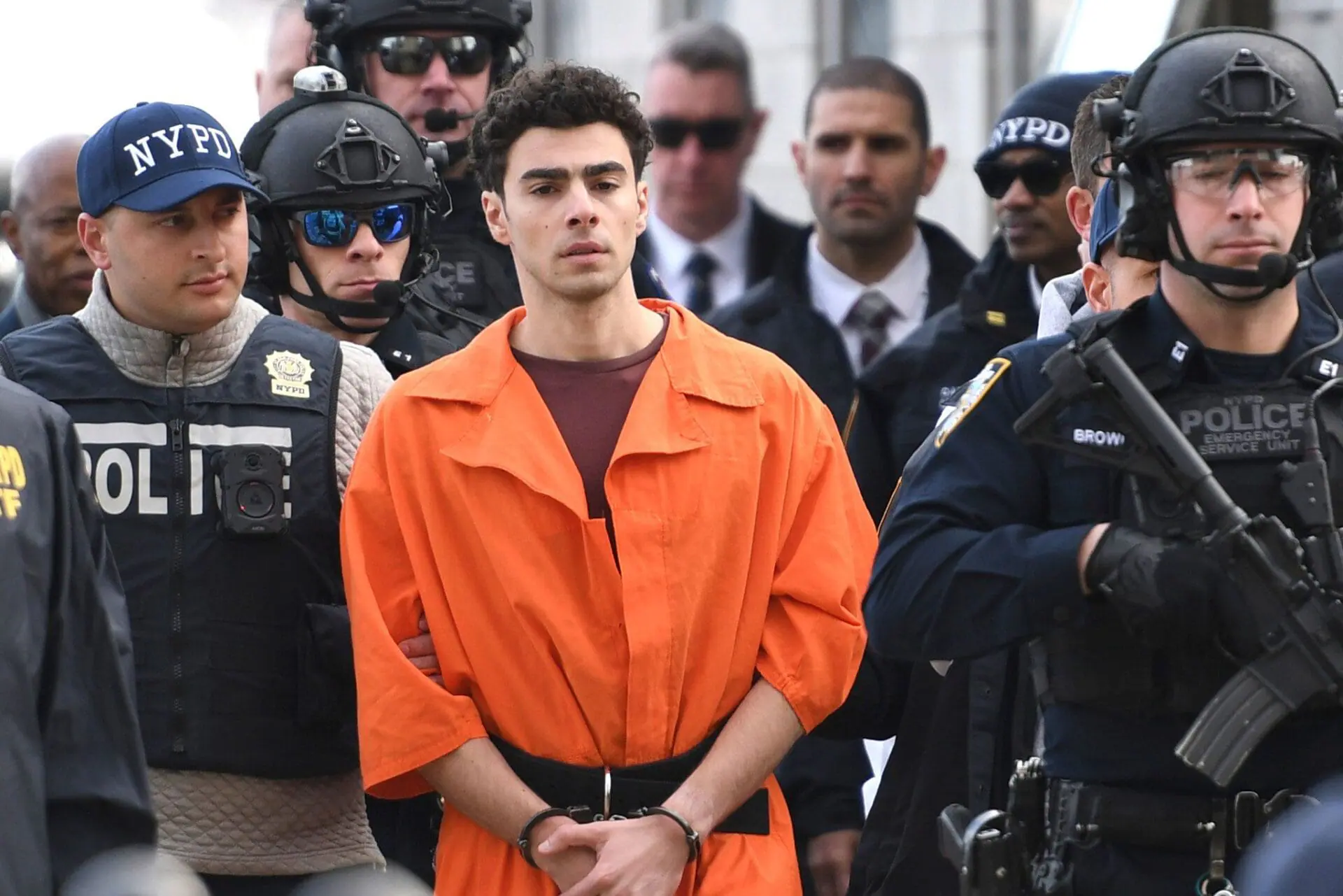 Luigi Mangione, the suspect in the fatal shooting of UnitedHealthcare CEO Brian Thompson, seen here on December 19, in New York is expected to be arraigned Monday in New York on state murder and terror charges. (Photo by Pamela Smith/AP via CNN Newsource)