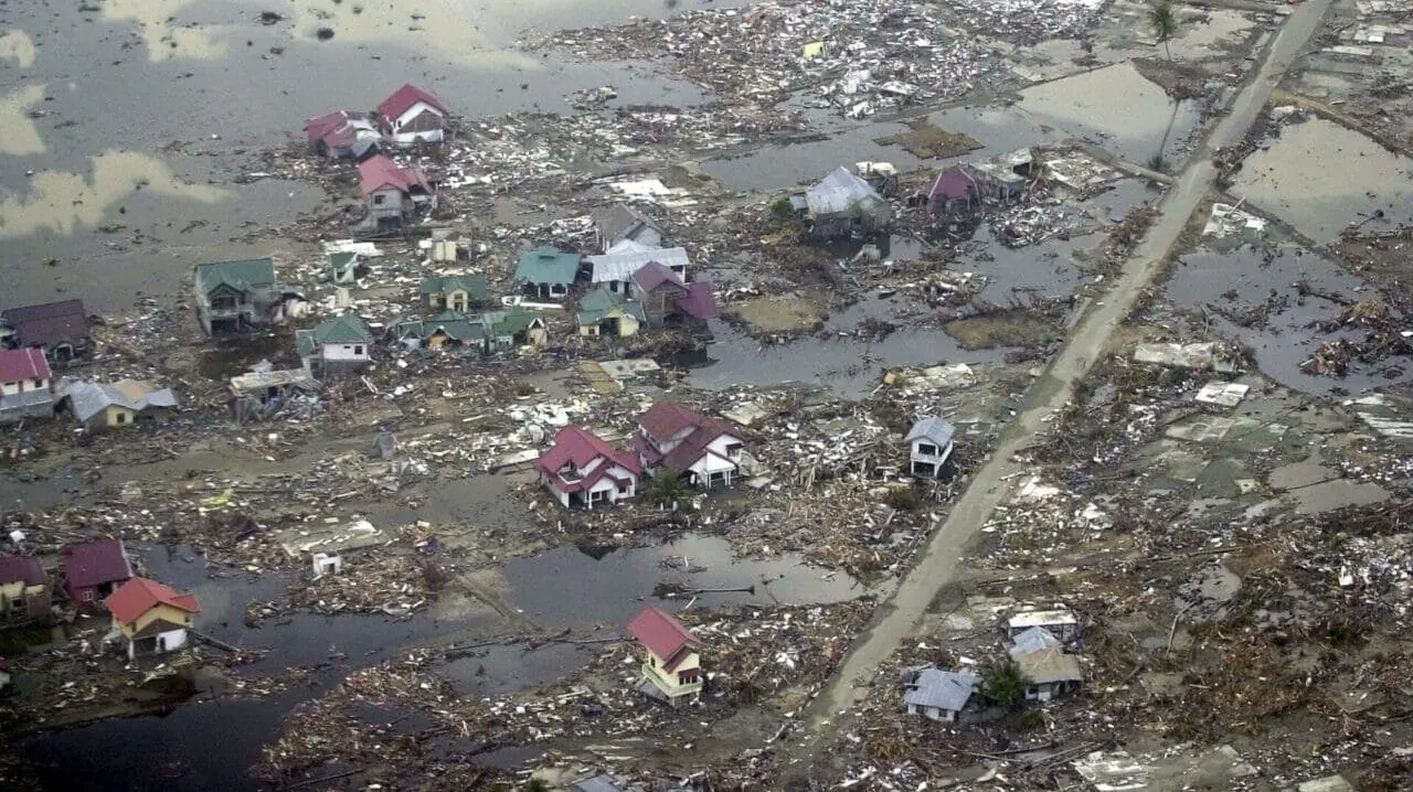 Destroyed houses are seen in this aerial view of the town of Meulaboh in Aceh province, Indonesia, which was flattened by tidal waves, on Saturday, Jan. 1, 2005. (AP Photo/Dudi Anung, File)