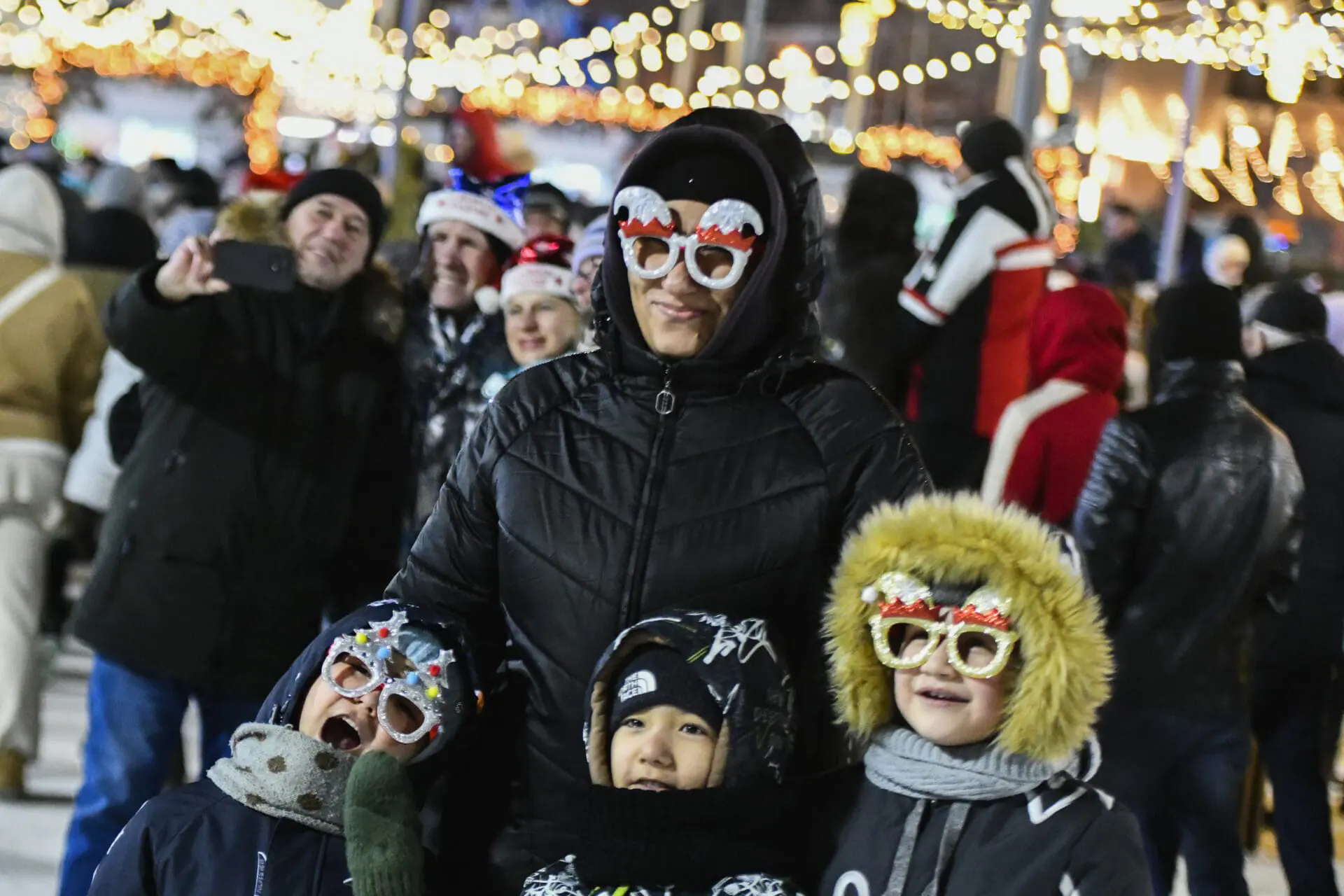 People gather in the center of the Russian far east port of Vladivostok, Russia, Tuesday, Dec. 31, 2024, to celebrate the new year. (AP Photo)