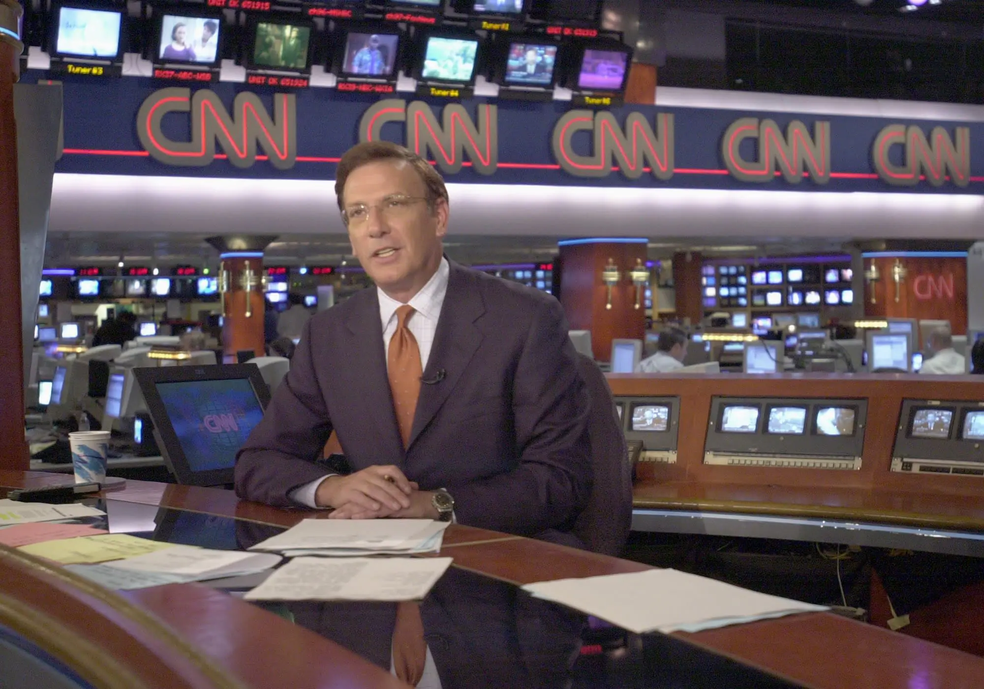 Aaron Brown delivers the news from CNN's headquarters in Atlanta, Georgia, in October 2001. (Provided Photo/Erik S. Lesser/Getty Images via CNN Newsource)