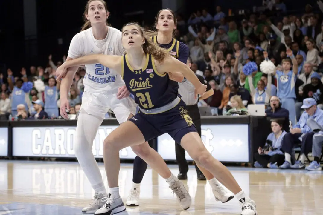 Notre Dame forward Maddy Westbeld, right, boxes out North Carolina forward Ciera Toomey, left, during the first half of an NCAA college basketball game Sunday, Jan. 5, 2025, in Chapel Hill, N.C. (AP Photo/Chris Seward)